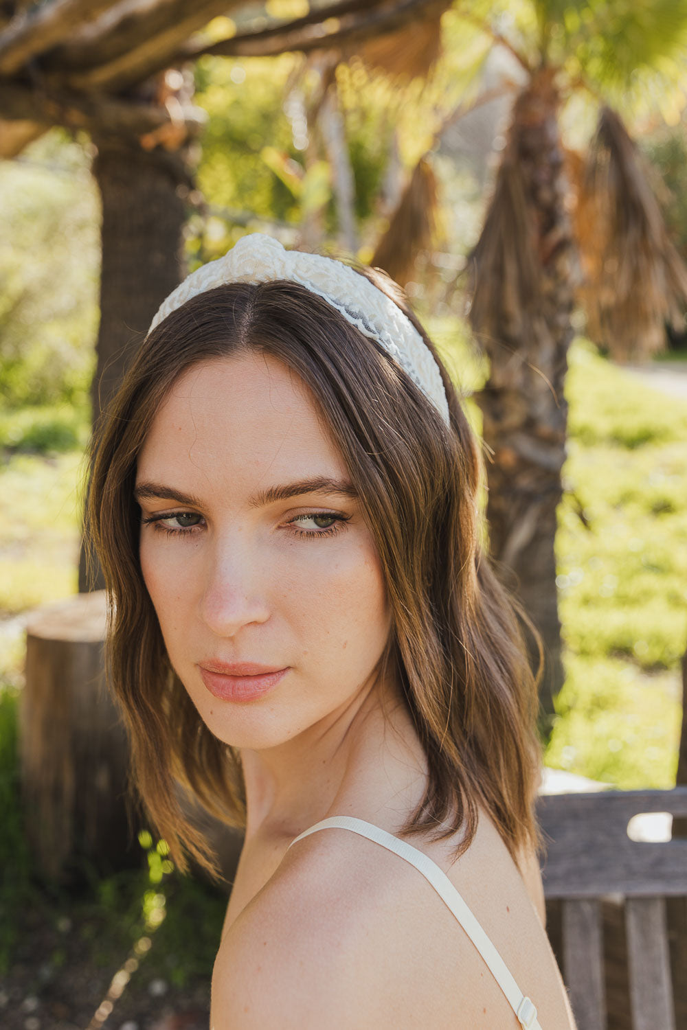 Ivory vintage-inspired floral vine knotted headband for versatile style.